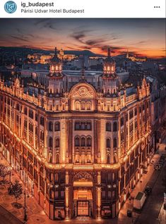 an old building lit up at night in the city