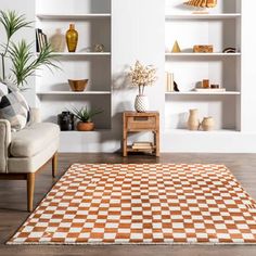 an orange and white checkered rug in a living room