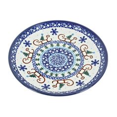 a blue and white plate with designs on it