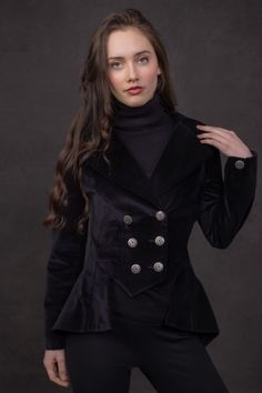 This style draws inspiration from a Victorian lady's riding habit, which we have reimagined for the contemporary woman. In doing so, we've preserved the intricate details that enhance the silhouette, blending historical elegance with modern sensibility. Our Lady Mary Jackets are cut and sewn in our Scottish studios by highly experienced seamstresses. We take immense pride in every style we sew here and you can be assured that your style is perfectly tailored. This style features a highly tailored, double-breasted design that accentuates the waist. We recommend selecting the larger size for the best fit if you're between sizes. Our velvet is the highest quality available, woven in a traditional mill in England. Fully Lined. Historical Long Sleeve Outerwear For Fall, Historical Design Long Sleeve Outerwear For Fall, Fitted Blazer With Stand Collar, Fitted Historical Outerwear For Fall, Timeless Double-breasted Fitted Outerwear, Timeless Fitted Double-breasted Outerwear, Fitted Outerwear With Stand Collar And Buttons, Fitted Gothic Long Sleeve Outerwear, Elegant Blazer With Covered Buttons And Stand Collar