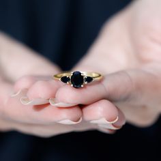 Product Details Mark the special day of your life by gifting your beloved this lovely Three Stone Ring. This Anniversary Ring for Women is adorned with Oval and Pear Cut Black Onyx to make for a luxurious choice for your lady. Crafted with Solid Gold to offer is an opulent appeal. Product Information SKU SHP-RINGS032218641 Width 4.5 mm Height 8 mm Weight 1.92 gm (Approximate) BLACK ONYX INFORMATION No.of Stones 3 Pieces Total Weight 1.46 Carat (Approximate) Dimension(approx) Oval-6X8 mm-1 PcsPea Classic Black Oval Sapphire Ring, Classic Black Sapphire Oval Ring, Black Oval Sapphire Promise Ring, Black Oval Anniversary Ring, Black Oval Rings For Anniversary, Classic Black Jewelry With Accent Stones, Classic Black Spinel Sapphire Ring For Anniversary, Fine Jewelry Three Stone For Proposal, Classic Black Sapphire Promise Ring