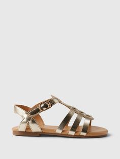 These sandals are made with a metallic faux leather upper.  Rubber gripper sole.  Strap and buckle closure at ankle.  For more fit and sizing info, check out our Size Guide. Rainbow Heels, Beach Stuff, Sandals Gold, Toddler Shoes, Pink Brown, Strap Sandals, Brown Gold, Size Guide, Gold Metal