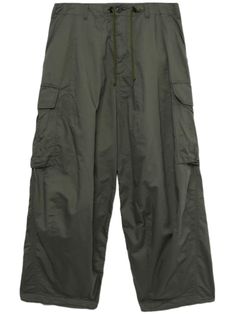 olive green cotton oversize frame dart detailing toggle-fastening drawstring waistband belt loops front button and zip fastening slip pockets to the sides two rear flap pockets two side cargo pockets wide leg tapered hem Military Style Baggy Parachute Pants, Military Style Baggy Parachute Pants With Patch Pockets, Military Style Khaki Parachute Trousers, Military Style Khaki Parachute Pants With Patch Pockets, Khaki Baggy Military Parachute Pants, Khaki Military Style Parachute Pants, Olive Cargo Bottoms For Outdoor, Military Style Olive Parachute Pants With Pockets, Military Style Khaki Parachute Pants With Pockets