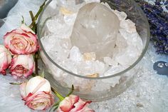 an ice bucket with some flowers on it