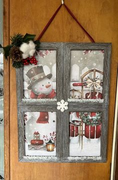 an old window is decorated for christmas with snowmen and other holiday decorations hanging on the front door