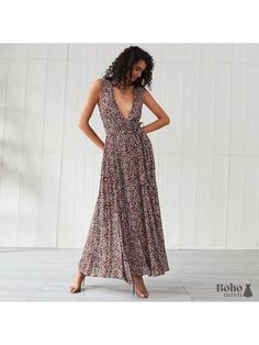 A bohemian dress with a flower motif that is long and stylish. You'll undoubtedly draw attention in this long and stylish bohemian dress! We like how it has a wraparound fit and a matching ribbon belt to help you define your body form. The flowing fabric below the waistline moves to the beat of your steps. The maxi length flatters your figure, and the flowery print gives the outfit a bohemian vibe. This bohemian floral maxi dress for ladies is ideal for a city outing, a special celebration, or a Bohemian V-neck Dress With Tie Waist, Beach Maxi Dress With Tie Waist And Surplice Neckline, Flowy Belted Maxi Length Wrap Dress, Belted Surplice Neckline Beach Dress, Belted Beach Dress With Surplice Neckline, Bohemian Fitted Wrap Dress With Surplice Neckline, Bohemian Flowy Wrap Dress With Surplice Neckline, Bohemian Wrap Dress With Tie Waist Maxi Length, Bohemian V-neck Belted Dress