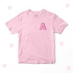 Embroidered Initial T-shirt Children's Embroidered Clothing 100% Cotton. Available in White, Pink, Blue + Black. Available in sizes: 1-2 Years 2-3 Years 3-4 Years 5-6 Years 7-8 Years 9-10 Years  11-12 Years 13-14 Years 40 degree wash. Do not bleach. Do not tumble dry. Do not dry clean. Warm iron. All of our Products are hand pressed and printed. PERSONALISED: If you have ordered a product to be personalised, please ensure that you use our 'Add Notes' feature at the checkout to add Dates, Names o Pink Embroidered Cotton T-shirt, Pink T-shirt With Embroidered Text For Summer, Pink Embroidered T-shirt For Summer, Cute Pink T-shirt With Letter Embroidery, Pink Crew Neck T-shirt With Embroidered Graphics, Pink Relaxed Fit T-shirt For School, Pink Family Matching T-shirt With Letter Print, Pink Family Matching Graphic T-shirt, Family Matching Pink T-shirt With Letter Print