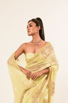 Discover our exquisite light-yellow crepe silk saree. Beautifully soft and detailed with intricate hand embroidery by skilled artisans, it adds elegant sophistication to any ensemble. Yellow Pre-draped Saree With Resham Embroidery, Pista Green Saree With Intricate Embroidery, Pista Green Georgette Saree With Intricate Embroidery, Gold Silk Pre-draped Saree With Intricate Embroidery, Pista Green Saree With Intricate Embroidery For Reception, Yellow Chinon Traditional Wear With Intricate Embroidery, Elegant Embroidered Pista Green Blouse Piece, Pista Green Chanderi Saree With Intricate Embroidery, Unstitched Pista Green Saree With Intricate Embroidery