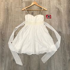 Nwt Trixxi Sleeveless Eyelet Dress In White. - Size 5 In Juniors, Which Is Probably Equivalent To A Women’s Size 2-4. - Features A Tie Detail In The Back, Adjustable Cami Straps And Padding In The Bust Area. - Fully Lined With A Back Zipper And Clasp. - Self: 100% Cotton. Lining: 100% Polyester. - Machine Wash Cold With Like Colors Gentle Cycle. Eyelet Is A Classic Design That's Always In Style! Purchased From Macy's In 2013 And Never Worn! Kept In The Plastic Garment Bag.