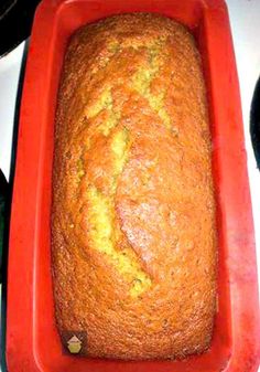 a loaf of bread sitting on top of a red pan