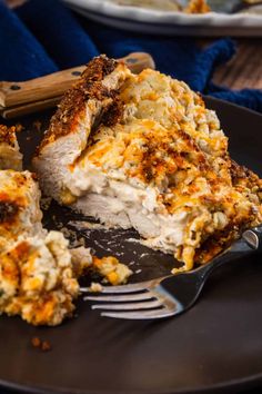 a piece of chicken casserole on a plate with a fork next to it