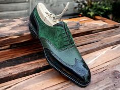 Step into sophistication with our meticulously crafted Men's Wingtip Oxford Shoes, handcrafted in luxurious green leather. Our bespoke lace-up shoes feature intricate details and sophisticated design, perfect for formal occasions. Made from premium grain leather and suede, these three-toned shoes exude elegance and style. Elevate your wardrobe with our exclusive collection of handmade luxury footwear, tailored for the discerning gentleman. 100% Original Handmade Premium Quality Leather Shoes & Boots Top Niche Features: - Detailed Stitching and Craftsmanship. - Leather Heel. - Soft Pre No..r Leather Lining. - 100% Leather Sole. - Ultra Comfortable - Sustainable and Eco-Friendly - Used for various Men's Dress Styles. For EU, UK, and USA sizes, please check the size chart in the pictures. Ple Green Wingtip Business Dress Shoes, Green Leather Brogue Shoes For Formal Occasions, Green Formal Leather Shoes With Brogue Detailing, Formal Green Leather Shoes With Brogue Detailing, Green Wingtip Oxfords With Goodyear Welt, Elegant Green Leather Shoes With Goodyear Welt, Elegant Green Goodyear Welted Leather Shoes, Green Goodyear Welted Wingtip Oxfords, Green Wingtip Oxfords For Formal Occasions