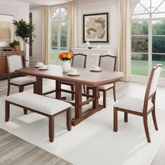 a dining room table and chairs with white upholstered seats in front of large windows