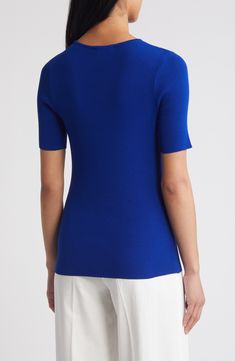 This lightweight, fine-gauge sweater provides a pop of color to perk up your everyday look. Jewel neck Short sleeves 72% rayon, 28% polyester Dry clean Imported Blue Stretch Tops For Workwear, Modern Textured Knit Tops For Work, Classic Blue Textured Knit Top, Classic Blue Knit Tops, Fitted Blue V-neck Knit Top, Blue Fitted V-neck Knit Top, Classic Blue Tops For Layering, Classic Blue Stretch Tops, Blue Top With Seamless Collar For Work