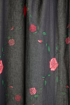 a curtain with pink roses on it