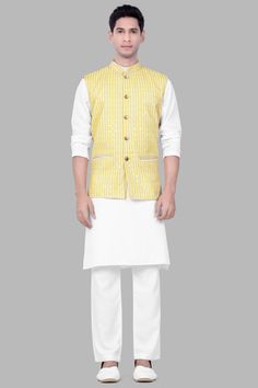 Elevate your festive ensemble with our Drover Yellow and Bright White Striped Designer Thread Embroidered Nehru Jacket. Perfect for weddings, engagements, or parties, this exquisite piece seamlessly blends style and comfort. Crafted for casual wear, it pairs flawlessly with a Kurta Jacket Set, offering a refined look for any occasion. Embrace sophistication with this Nehru Jacket for men, adorned with intricate thread embroidery, making it a timeless addition to your wardrobe. In addition to bei Embroidered Straight Kurta Bandhgala For Reception, Cotton Bandhgala With Resham Embroidery For Wedding, Cotton Sherwani With Gota Work For Wedding, Cotton Bandhgala With Zari Work For Wedding, Wedding Cotton Bandhgala With Resham Embroidery, Wedding Cotton Bandhgala With Zari Work, Wedding Cotton Bandhgala With Gota Work, Elegant Designer Cotton Nehru Jacket, Elegant Cotton Nehru Jacket With Chikankari Embroidery