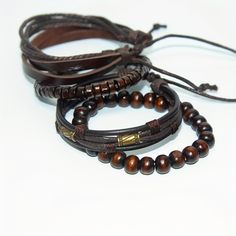 Elevate your wrist game with our 4pc braided leather brown bracelet set. Crafted from high-quality leather, these bracelets offer a stylish and versatile accessory option for any occasion. Whether you're dressing up for a night out or keeping it casual during the day, these trendy bracelets will add a touch of sophistication to your look. The set includes four different designs, allowing you to mix and match or wear them separately for a variety of looks. With their comfortable fit and durable construction, these bracelets are sure to become a staple in your accessory collection. Key Features; 👑 Stylish Designs: Each bracelet features a unique braided leather design, adding texture and visual interest to your wristwear. 💼 Versatile Accessory: Perfect for both casual and formal occasions, Masculine Adjustable Braided Bracelets With Leather Strap, Masculine Adjustable Braided Leather Bracelet, Casual Brown Braided Leather Bracelet, Casual Brown Leather Strap Braided Bracelet, Casual Brown Leather Braided Bracelets, Casual Brown Leather Braided Bracelet, Masculine Brown Braided Bracelet As Gift, Masculine Brown Braided Bracelet For Gift, Casual Brown Leather Beaded Bracelets