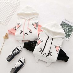 Be the Cat's Meow with Our Adorable Anime Cat Hoodie Meow-wow! Looking for a cute and playful way to show off your love for all things feline? Look no further than our Kawaii Japanese Cat Hoodie! With its sweet cat face on the front and paw prints on the bottom, you'll be the most kawaii kitty in town 🥰 Stay Cozy and Cute All Year Long Our hoodie isn't just stylish - it's practical, too! Made from a premium blend of cotton and polyester, it feels soft and smooth against your skin, making it the White Hooded Kawaii Top, White Kawaii Hoodie With Cartoon Print, White Kawaii Hoodie Top, Cute Cat Print Hooded Hoodie, Kawaii Long Sleeve Hoodie With Cat Design, White Cat Print Top For Winter, Cute White Winter Hoodie, White Cat Design Top For Winter, White Cotton Sweatshirt With Cat Print