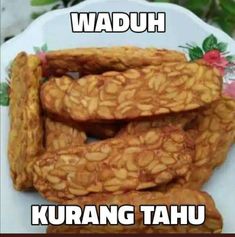 some kind of food on a plate with words in the middle that read waduh kurang tahu