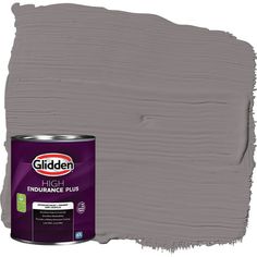 a can of paint that is green with the words glidden on it