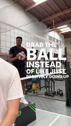 two men standing in front of a net with a volleyball ball on it and the caption grab the ball instead of like just play, going up