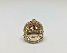 Vintage 14k Yellow Gold Wide Filigree Oval Garnet & Round Pearl Ring Size 6.5 Metal: 14k yellow gold, stamped Weight: 6.6 grams Ring size: 6 1/2 (can be resized upon request) Width: 17mm wide (at widest points) Stones: Center round pearl aprx. 2.60mm, 6 oval garnet stones aprx. 5mm x 3mm Hallmarked: 14k This is an estate piece in very good condition. Please see pictures for reference. Gold Oval Gemstone Filigree Ring, Ornate Gold Oval Filigree Ring, Ornate Yellow Gold Oval Filigree Ring, Gold Oval Filigree Ring Fine Jewelry, Oval Yellow Gold Filigree Ring Stamped 14k, Gold Oval Filigree Collectible Ring, Garnet Stone, New City, Multi Stone Ring