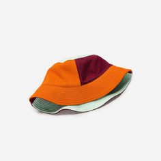 Colorful jacquard knit bucket hat with deadstock neon topstitching. Details Body: 100% Acrylic Lining: 100% CottonMachine wash gentle, lay flat to reshape and dry8.5"w, 3.5"h, 2.25" brim Multicolor Bucket Hat For Spring Outdoor, Trendy Multicolor Bucket Hat For Outdoor, Spring Multicolor Bucket Hat For Outdoor, Multicolor Reversible Cotton Bucket Hat, Trendy Multicolor Sun Hat For Outdoor, Reversible Multicolor Cotton Bucket Hat, Multicolor Patchwork Casual Hat, Casual Multicolor Patchwork Hat, Orange Cotton Bucket Hat For Summer