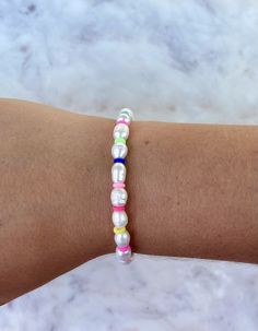 The Maisie Bracelet is the perfect bracelet for every occasion. This bracelet is handmade with a mix of freshwater pearls and rainbow heishi beads. It is approximately 7 inches long. *Please message me if you need your bracelet to be a different length. If you would like the matching necklace, click on the link below! https://shopkendallsjewels.etsy.com/listing/914539636/smiley-face-ring-adjustable-ring?ref=shop_home_active_7&crt=1 White Pearl Bracelet With Colorful Beads For Everyday, Everyday White Pearl Bracelet With Colorful Beads, Multicolor Hand-strung Pearl Bracelet, White Tiny Beads Pearl Bracelet For Friendship, White Pearl Bracelet With Tiny Beads For Friendship, Bracelet Preppy, Fresh Water Pearl Bracelet, Heishi Bead Bracelet, Preppy Bracelets