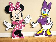 mickey and minnie mouse cut outs on the wall