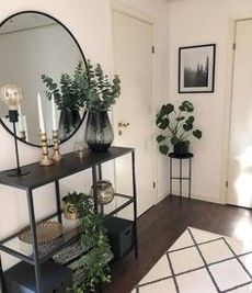 a living room filled with furniture and a large round mirror on the wall above it