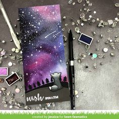 a notebook with the words wish upon it, surrounded by jewels and other items that are scattered around