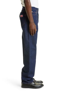 First-day-blue Japanese denim keeps you all-occasion smart in jeans that sport a slim cut and KENZO Artistic Director Nigo's real-to-wear philosophy. 32" inseam; 17" leg opening; 13 1/4" front rise; 16 1/2" back rise (size 32) Zip fly with button closure Five-pocket style 100% cotton Machine wash, line dry Imported New Concepts @Nordstrom Classic Full Length Blue Jeans, Classic Blue Rigid Denim Bottoms, Modern Blue Relaxed Fit Jeans, Classic Blue Jeans For Streetwear, Blue Straight Hem Recycled Denim Jeans, Blue Cotton Jeans With Standard Cut Leg, Blue Jeans With Straight Hem In Recycled Denim, Blue Straight Relaxed Fit Jeans, Blue Denim Jeans With Straight Hem