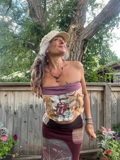 This is a one of a kind  Zasra design. This listing is for the eco  made, tube top. For this one of a kind eco tube top, I chose a patchwork mix of cottons, in a pretty hippy floral mix. The  color mix is curry, tan, toffee, cream, turquoise,maroon, cherry, purple, orange, lime, copper, mustard. Added extra upcycled, Rolling Stones  appliqué.  The one of a kind necklace, earrings,  I made too, and are available in my shop.   Size XS/S  model wears a 4/6 5'4 and is a 36" B fit at max Length~ 12" Hippie Patchwork Tops For Festival, Summer Patchwork Crop Top, Summer Patchwork Cropped Crop Top, Funky Multicolor Tops For Festival, Bohemian Cropped Tops For Music Festival, Bohemian Cotton Crop Top For Music Festival, Cotton Bohemian Crop Top For Music Festival, Hippie Fitted Patchwork Tops, Hippie Crop Top For Music Festival