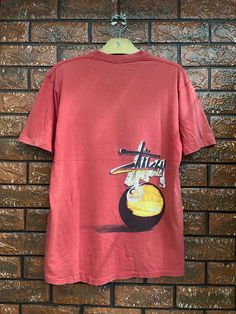 90s OG Stussy NY "Eight Ball" Double S Era Graphic T Shirt / Old Skates T Shirt / Shawn Stussy / 90s Streetwear T Shirt Made In Usa M Condition : Heavy Used  Size on tag : M Colour : Red Brand : Stussy Measurement : Armpit to armpit - 20" Length - 26" Material : Old Cotton Made In: USA  THE SHIPPING (Your Choice Please read) 1. The shipping cost is USD 20 via Malaysian Registered Postage With Tracking Number. It will take 2-4 weeks or more for delivery, depends on your custom checking. 2. Add US Stussy 90s, Shawn Stussy, Eight Ball, Double S, Skate T Shirts, Streetwear T Shirt, Shirt Streetwear, 90s Streetwear, Streetwear Tshirt