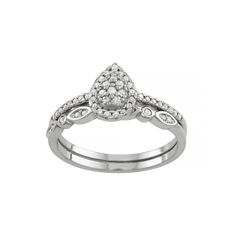 a white gold ring with diamonds on the sides and a diamond set in the center