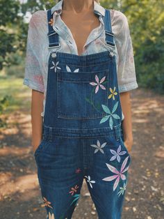 🌸Hand Painted Dungarees - by Denim Sanctuary Bright vibrant colours perfect for festivals a definite head turner.🌼 🌱Each piece takes between 3 to 5 days to finish and is one of a kind, bespoke and completely unique ..none are the same but all are just as beautiful as each other in their own way! If you have a perfect piece at home, I can personalise you're beloved denim pieces (the old guys and the new) and nurture them back to their former glory..🌺 🌸Just pop me a message. Ladies, men's, ch Painting Overalls Outfit, Hand Painted Overalls, Painted Overalls Diy, Summer Bohemian Dark Wash Jeans, Bohemian Dark Wash Jeans For Summer, Summer Festival Dark Wash Jeans, Dark Wash Jeans For Summer Festival, Relaxed Fit Jeans For Summer Festival, Summer Hippie Blue Jeans