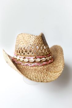 Did someone say coastal cowgirl summer??? Beach day? Country concert? Girls trip? Our handmade cowgirl hats are the PERFECT accessory for any outfit! The Kaipo (or Sweetheart) Hat is a tan straw cowgirl hat decorated with pink & gold ribbon, plain cowrie shells, & gold chain. Coastal Cowboy Party, Beach Cowgirl Hat, Coastal Cowboy Hat, Custom Cowgirl Hats, Coastal Cowgirl Hat, Beach Cowboy Hat, Coastal Cowgirl Outfit, Straw Cowgirl Hat, Cowgirl Halloween Costume