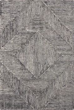 an old black and white photo of a pattern on fabric, with lines in the middle