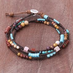 Alternating beads of jasper and dyed calcite are threaded onto a leather cord in this beautiful design by Thai artisan Sareeyakarn. The wrap style bracelet features an adjustable length with a silver button from the Karen hill tribe. Unusual Bead Cap Bracelets, Adjustable Bohemian Lariat Bracelets, Adjustable Bohemian Lariat Bracelet, Adjustable Multicolor Artisan Wrap Bracelet, Bohemian Adjustable Cord Bracelet For Meditation, Adjustable Hippie Bracelets With Natural Stones, Hippie Adjustable Bracelets With Natural Stones, Adjustable Natural Stone Beaded Bracelets For Festivals, Adjustable Spiritual Leather Bracelet With Natural Stones