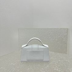 Size: Standard Size It comes with Dust box, Care manual, Tag, and Paper bag. White Modern Handheld Box Bag, Modern White Handheld Box Bag, Designer White Rectangular Flap Bag, Luxury White Rectangular Box Bag, Designer White Tote Box Bag, White Square Box Bag With Removable Pouch, Modern White Box Bag For Daily Use, White Handheld Box Bag With Detachable Handle, Modern White Shoulder Bag With Top Carry Handle