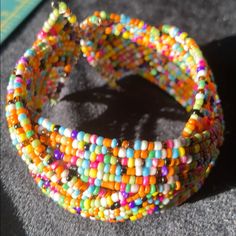 Seed Bead Bracelet Nwt Colored Beautiful. 7 3/4 Flat Lay Length Open End Adjustable Wrist #Boho # 80’s #Stylish #Vintagestyle #Seedbead Pink,Blue,Yellow,White,Black,Red Dark Pastel Thank You For Shopping Our Closet . (All Measurements Taken Laying Flat) And Are Approximately Smoke Free And Pet Free Home Any Offers All Reasonable Will Be Considered Please Contact Me I Will Be Happy To Assist You #Boho Colorful Beaded Stretch Bracelet For Festivals, Colorful Beaded Festival Stretch Bracelet, Multicolor Beaded Stretch Bracelet For Festival, Rainbow Beaded Stretch Bracelet, Rainbow Beaded Stretch Bracelet For Festival, Rainbow Colored Beaded Stretch Bracelet For Festival, Multicolor Stretch Bracelet With Tiny Beads, Multicolor Beaded Stretch Bangle Bracelet, Dark Pastel