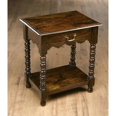 an old wooden table with two drawers on one side and a drawer on the other