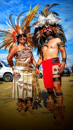 two men in native garb standing next to each other