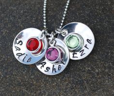 Mom necklace hand stamped silver with three names. $60.00, via Etsy. Silver Birthstone Necklace For Personalized Gift, Silver Birthstone Necklace With Round Pendant For Personalized Gift, Silver Name Necklace With Birthstone In Round Pendant, Sterling Silver Birthstone Necklace With Name, Customizable Silver Birthstone Necklace For Mom, Personalized Sterling Silver Round Pendant Birthstone Necklace, Nickel-free Silver Birthstone Necklace For Birthday, Silver Birthstone Pendant Necklace With Name, Personalized Silver Necklace For Mom