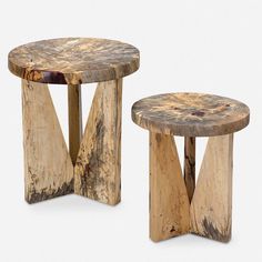 two wooden stools sitting next to each other