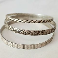 You get all three of these vintage Danecraft bracelets. Each sterling silver bangle featured a different pattern. Great for wearing stacked or individually. Plenty of patina still intact, but you could polish them to a high shine if you so choose. Please see all of the photos for a closer look. I have a 6.5 inch wrist, and they fit me with some room left to move about. Please see all of the photos for a closer look. Thanks. Sterling Silver Bangle Bracelets Antique, Vintage Sterling Silver Bracelets With Oxidized Finish, Handmade Vintage Sterling Silver Bracelets, Vintage Sterling Silver Bangle With Oxidized Finish, Vintage Oxidized Sterling Silver Bangle Bracelet, Ornate Stamped Bangle Bracelet, Vintage Sterling Silver Stamped Bangle, Handmade Vintage Sterling Silver Bangle, Vintage Oxidized Round Bangle