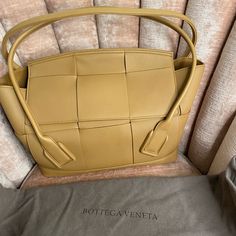 Caramel Color. Medium. Literally Never Used. In Original Box With Bag, Verification Code Available Yellow Bags With Intrecciato Weave For Everyday Use, Luxury Camel Rectangular Bag, Elegant Gold Shoulder Bag With Intrecciato Weave, Luxury Brown Bag With Intrecciato Weave, Luxury Brown Bags With Intrecciato Weave, Gold Rectangular Bag With Intrecciato Weave, Designer Camel Rectangular Bag, Luxury Caramel Rectangular Shoulder Bag, Elegant Gold Bag With Intrecciato Weave