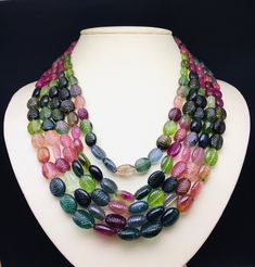 100 % Natural Multi Tourmaline carved oval shape beaded necklace with adjustable silk cord closure. Details: - Gemstone - Multi Tourmaline Shape - Oval Strand - 5 Calibration of beads - 8x10 millimeters till 13x18 millimeters Gross weight - 1442.50 carat Net weight - 1404.00 carat Length - 20 Inches ( Inner ) and 24 Inches ( Outer ) SKU - HJSPSAR0077 100% NATURAL MULTI TOURMALINE NOT HEATED NOT TREATED NOT DYED VERY RARE NECKLACE TO FIND EACH BEAD IN THE NECKLACE IS PERFECTLY HAND CARVED BY BEST Cheap Multi-strand Statement Beaded Necklaces, Luxury Multi-strand Beaded Necklaces For Party, Luxury Multi-strand Statement Beaded Necklace, Luxury Beaded Necklaces With Large Oval Beads, Luxury Multicolor Beaded Necklaces With Round Beads, Cheap Multi-strand Polished Bead Necklaces, Luxury Statement Multi-strand Beaded Necklaces, Luxury Multi-strand Necklace With Colorful Beads, Luxury Necklaces With Large Oval Beads