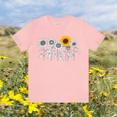 Elevate your style with our Minimalistic Sunflowers Unisex Tee, available in multiple colors and sizes. This charming tee features a minimalistic design of one-color sunflowers, offering a versatile and timeless look. #12 Boho Classic unisex jersey short sleeve tee fits like a well-loved favorite. Soft cotton and quality print make users fall in love with it over and over again. Ribbed knit collars to bolster shaping. Shoulders are tapered for a better fit over time. Dual side seams hold the garment's shape for longer. Fabric Details Made with 100% Airlume combed and ring-spun cotton, a lightweight fabric (4.2 oz/yd² (142 g/m²)) that is easy to layer, breathable. Perfect for active and leisure wear. Style Features The retail fit is perfect for casual and semi-formal settings. The crew neck Summer Floral Print T-shirt For Everyday, Floral Print T-shirt For Summer, Trendy Summer T-shirt With Sunflower Print, Summer Sunflower Design Short Sleeve T-shirt, Summer Graphic Tee With Sunflower Print, Summer Cotton T-shirt With Sunflower Design, Relaxed Fit Short Sleeve T-shirt With Sunflower Design, Relaxed Fit Summer T-shirt With Sunflower Print, Relaxed Fit Cotton T-shirt With Sunflower Design