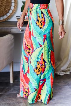 Keep your summer wardrobe fresh with Amara Tropical Pants. These playful pants feature fun tropical prints that will make you feel like you're on vacation year-round. Upgrade your style game with the ultimate tropical pants! 100% Polyester Color: Multi Tropical Abstract Print High waisted Pants Wide Leg Pants Front Tie Top Sold separately Functional side pockets Drawstring Front Tie Elastic Waist Band Light Weight True to size Model is wearing a size Small. She is 5'6". 135lbs. Bust: 34C Waist 2 Tropical Pants, Tropical Abstract, Tropical Prints, Bottom Workout, Pants Large, Pants Wide Leg, Front Tie Top, Dressy Tops, Tie Top